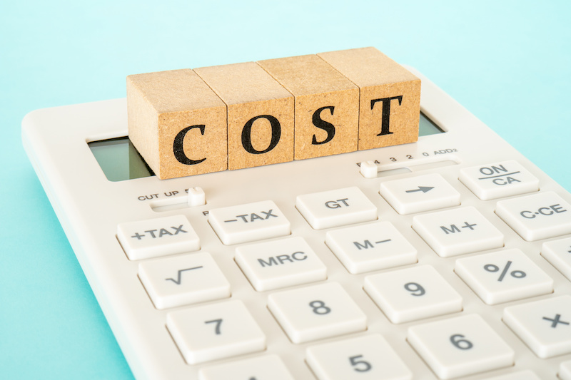 Concept of cost calculation (calculator and the word “COST”)